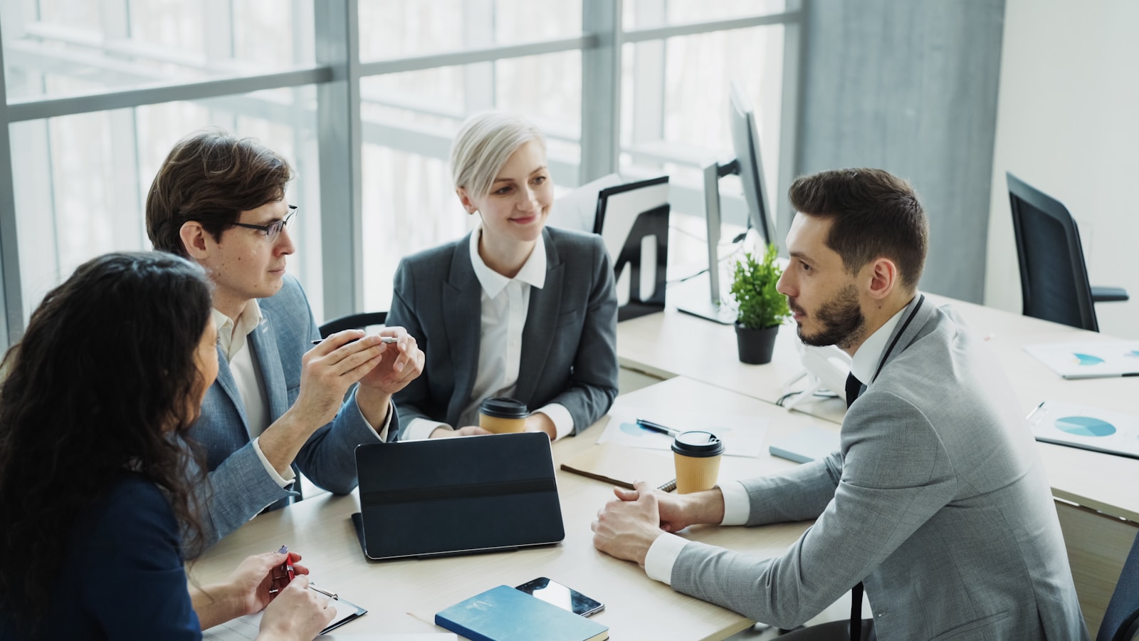 Team discussing a project in a modern office