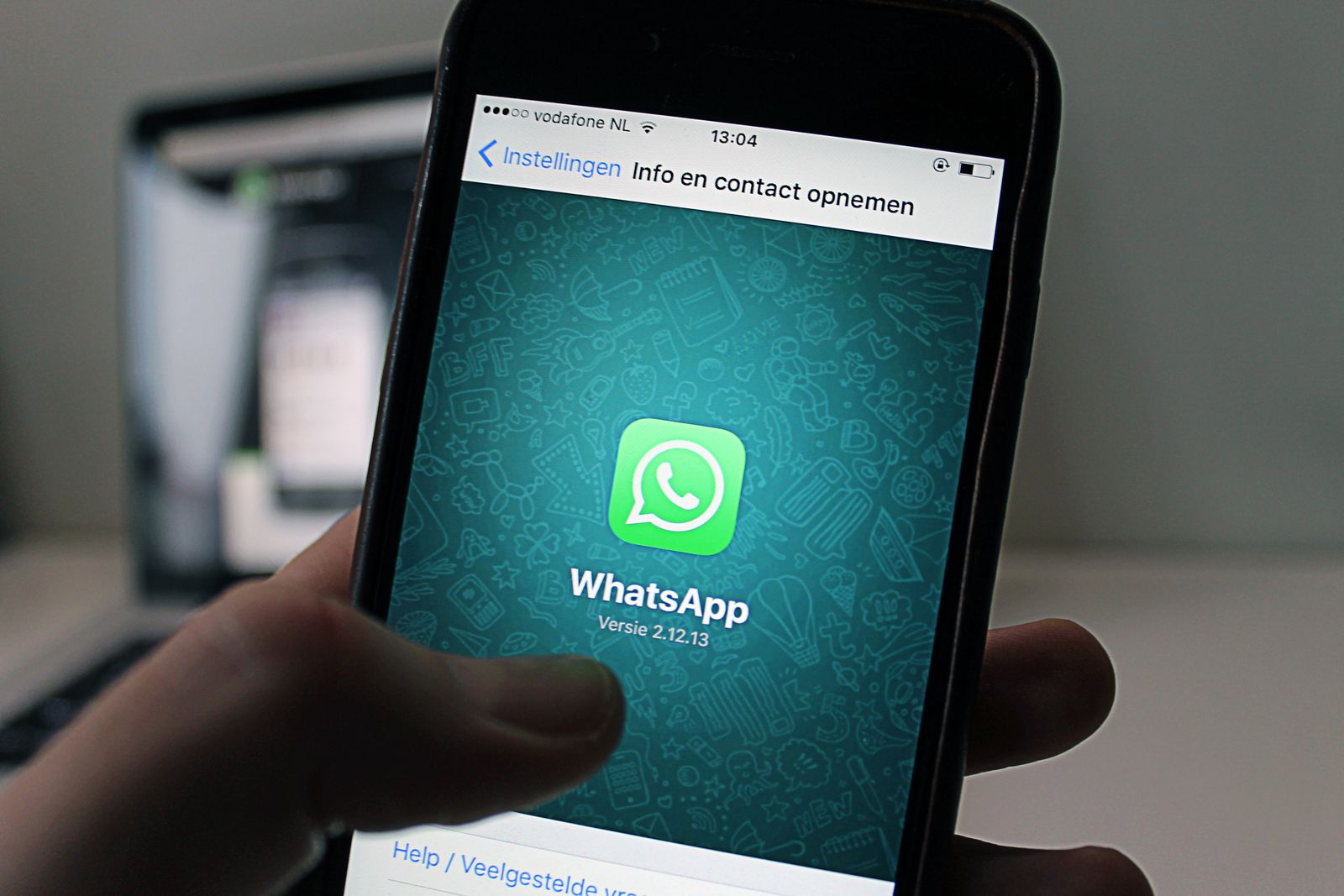 WhatsApp Business API messaging app on a smartphone for broadcasts and support